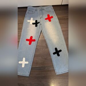 Stylish Light Blue Jeans with Cross Patches